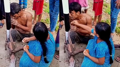 চুরির অভিযোগে আটক ক্ষুধার্ত বাবার মুখে রুটি তুলে দিচ্ছে মেয়ে